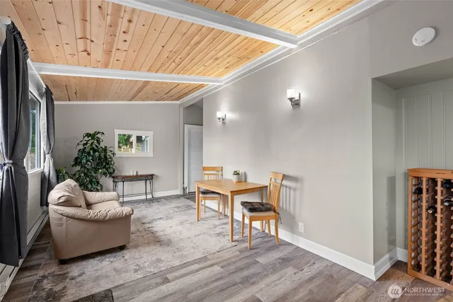 a living room with furniture and a rug