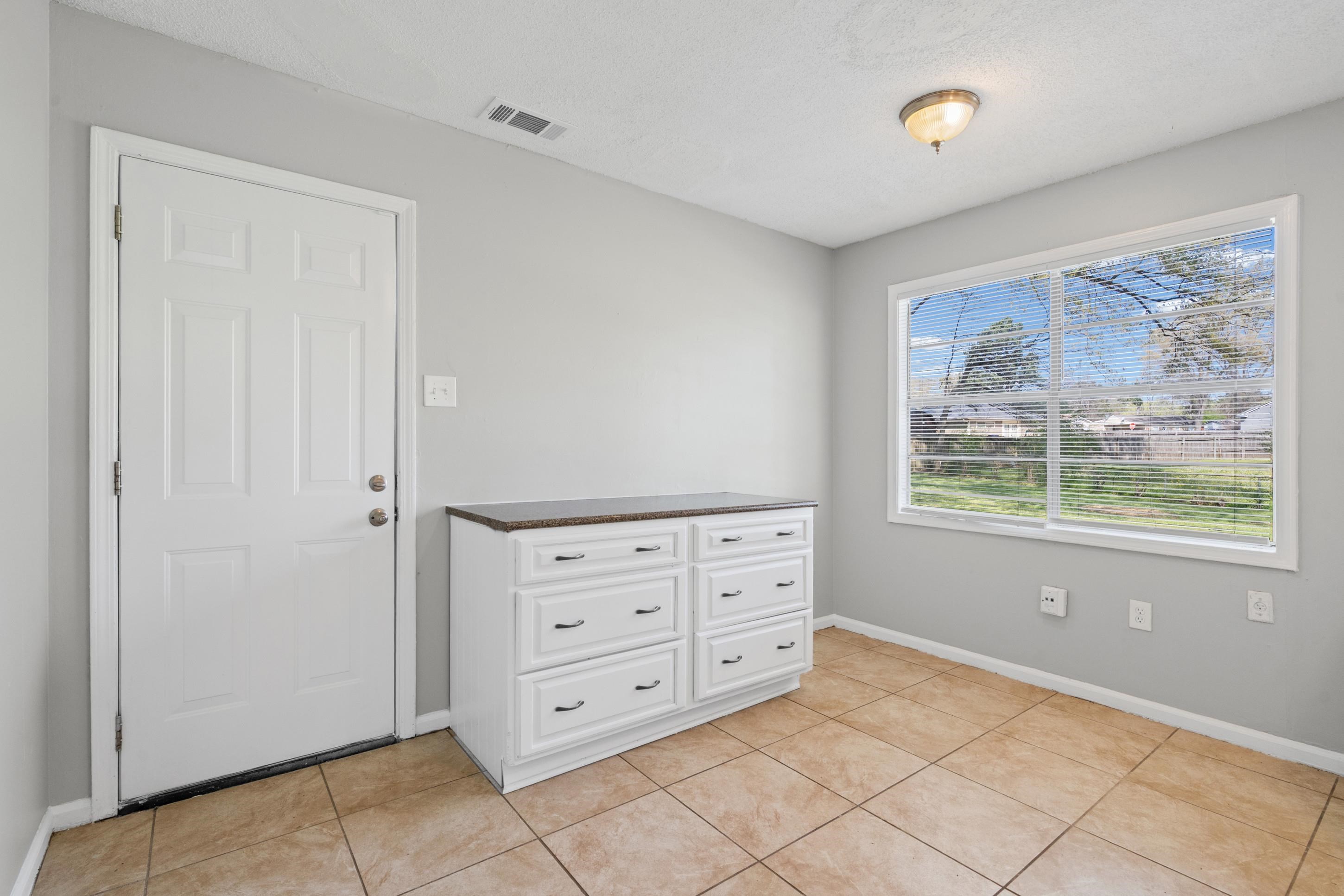 496 Greenview Cove Collierville, TN 38017 - Photo 13 of 24 a view of a bedroom with furniture and windows