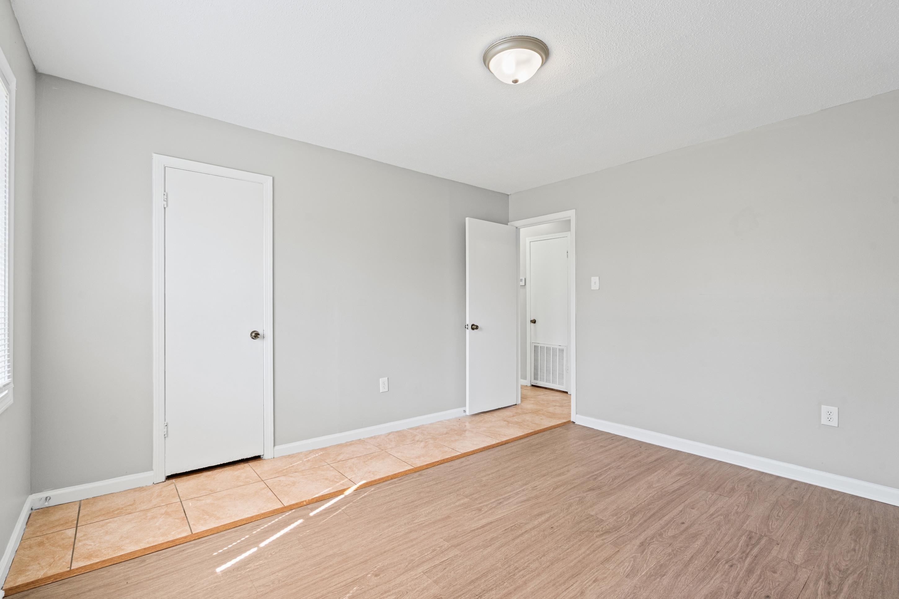 496 Greenview Cove Collierville, TN 38017 - Photo 16 of 24 a view of an empty room with wooden floor
