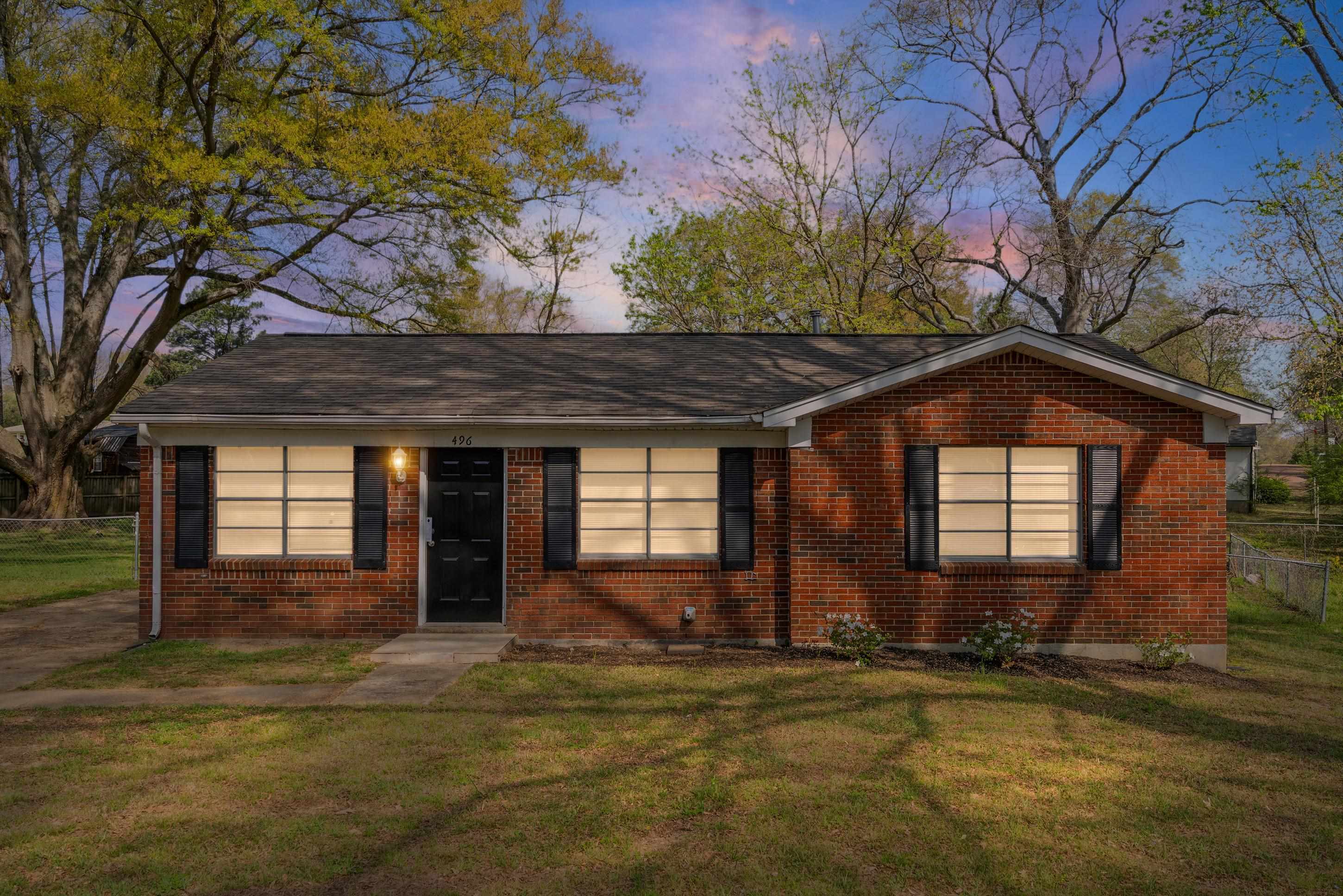 496 Greenview Cove Collierville, TN 38017 - Photo 3 of 24 a front view of a house with garden