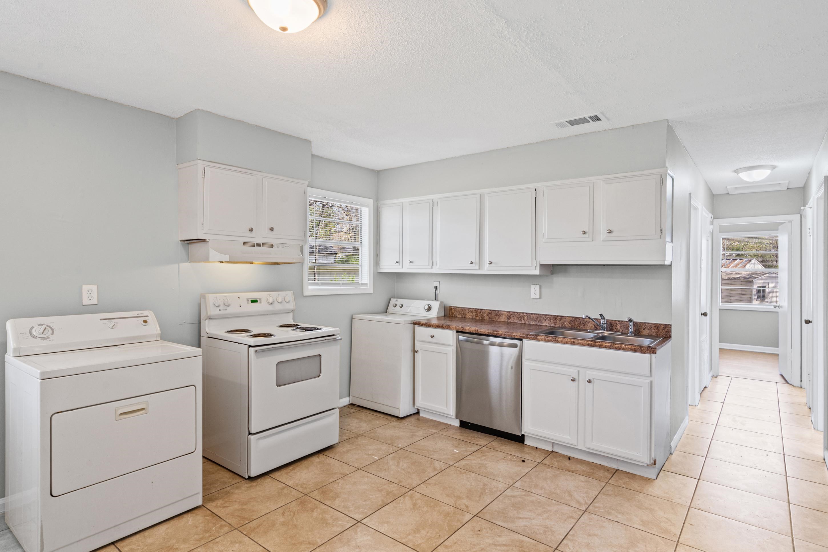 496 Greenview Cove Collierville, TN 38017 - Photo 7 of 24 a kitchen with cabinets appliances and a sink