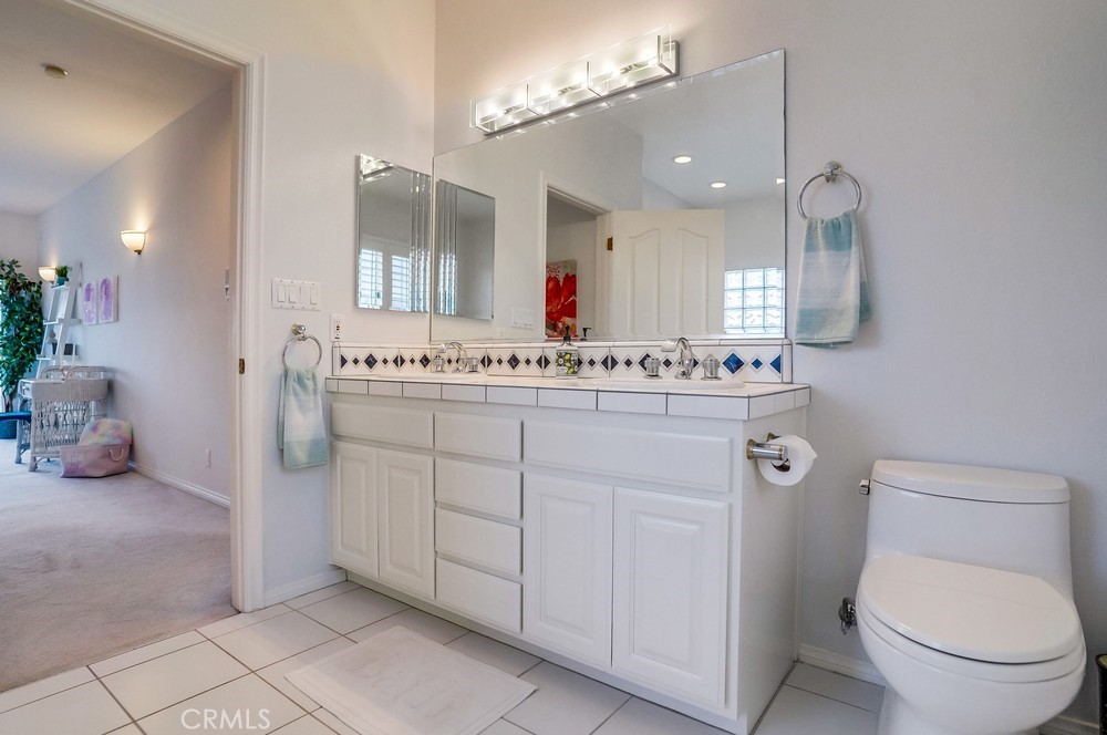 1820 Mantis Avenue San Pedro, CA 90732 - Photo 32 of 55 a bathroom with a sink vanity mirror and toilet