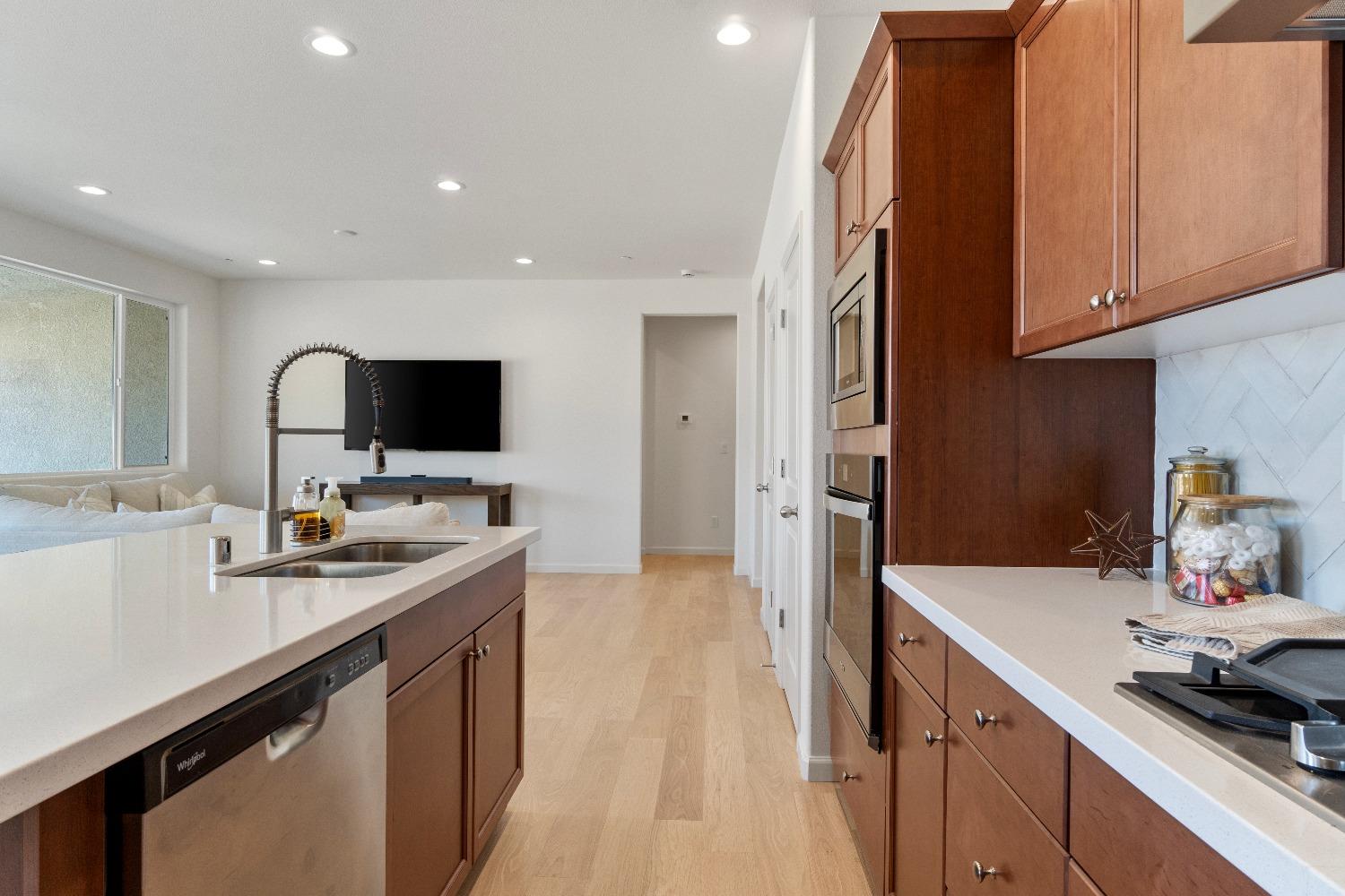 1241 Peters Road Madera, CA 93636 - Photo 13 of 37 a kitchen with a sink and cabinets