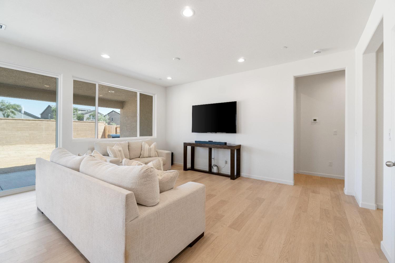 1241 Peters Road Madera, CA 93636 - Photo 18 of 37 a living room with furniture and a flat screen tv