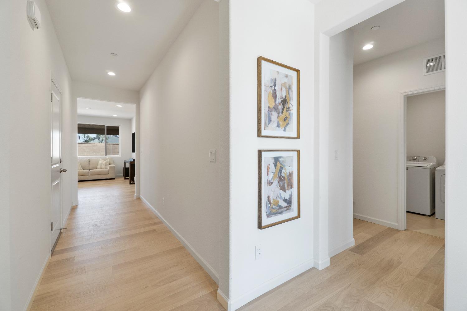 1241 Peters Road Madera, CA 93636 - Photo 19 of 37 a view of a hallway with wooden floor and windows