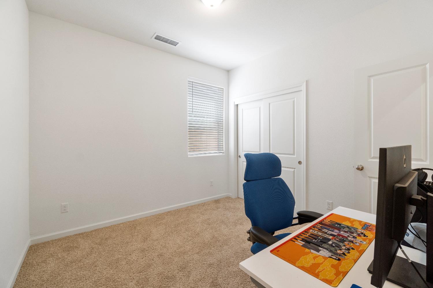 1241 Peters Road Madera, CA 93636 - Photo 25 of 37 a room with furniture and a window