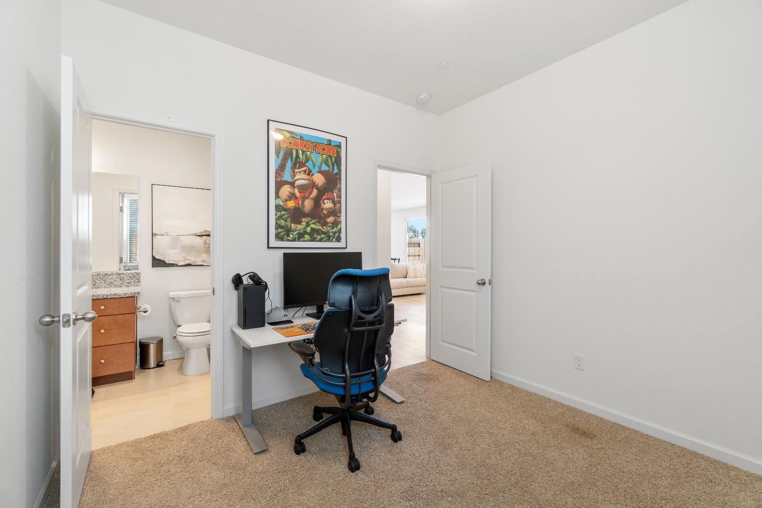 1241 Peters Road Madera, CA 93636 - Photo 26 of 37 a view of a workspace with furniture and a window