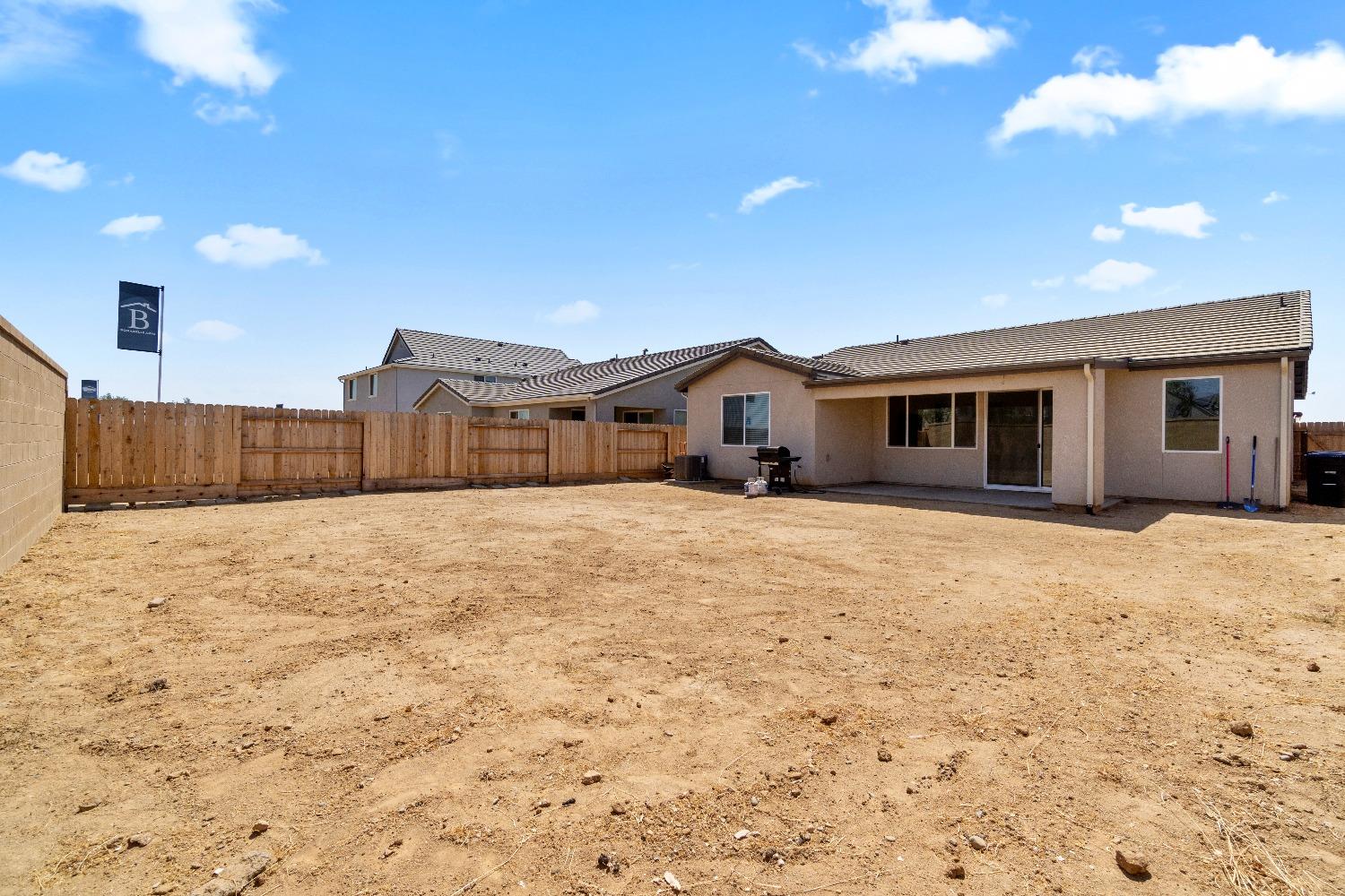 1241 Peters Road Madera, CA 93636 - Photo 31 of 37 a view of house with wooden fence