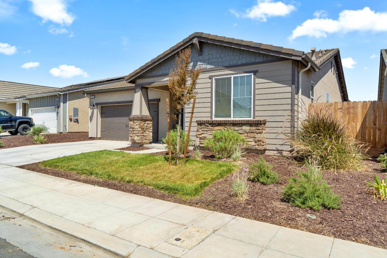 1241 Peters Road Madera, CA 93636 - Photo 6 of 37 a front view of a house with a yard