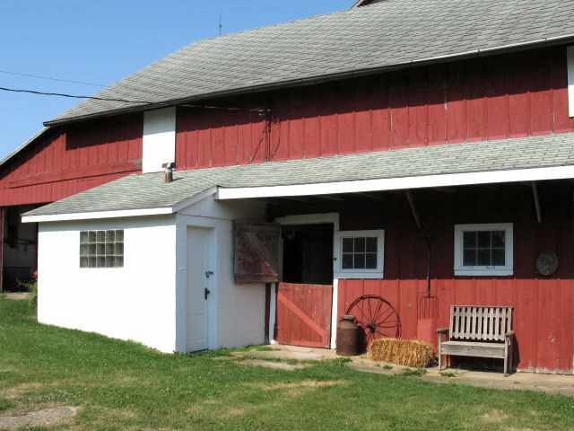 8942 North Unity Road Winslow, IL 61089 - Photo 12 of 12 a front view of a house with garden