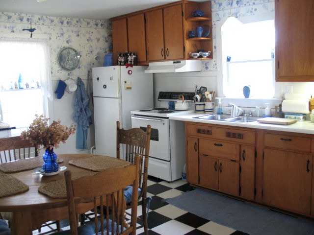 8942 North Unity Road Winslow, IL 61089 - Photo 4 of 12 a kitchen with a sink a stove and a refrigerator