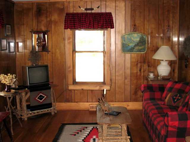 8942 North Unity Road Winslow, IL 61089 - Photo 5 of 12 a living room with furniture and a flat screen tv
