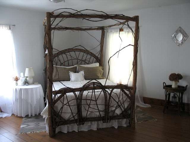 8942 North Unity Road Winslow, IL 61089 - Photo 7 of 12 a bedroom with a bed a table and chair