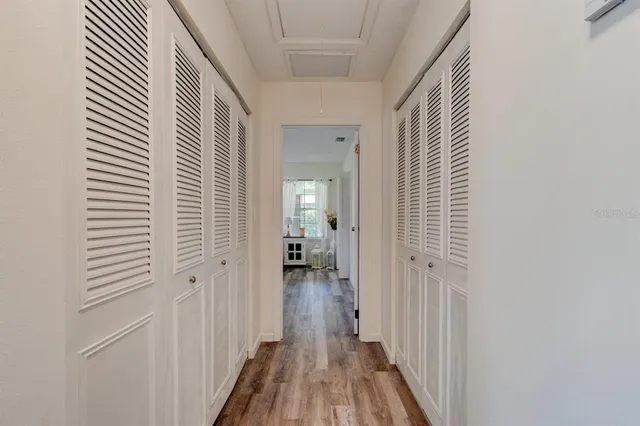 a view of a room with wooden floor