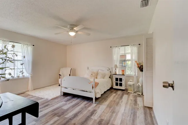 a bed room with a bed and a window