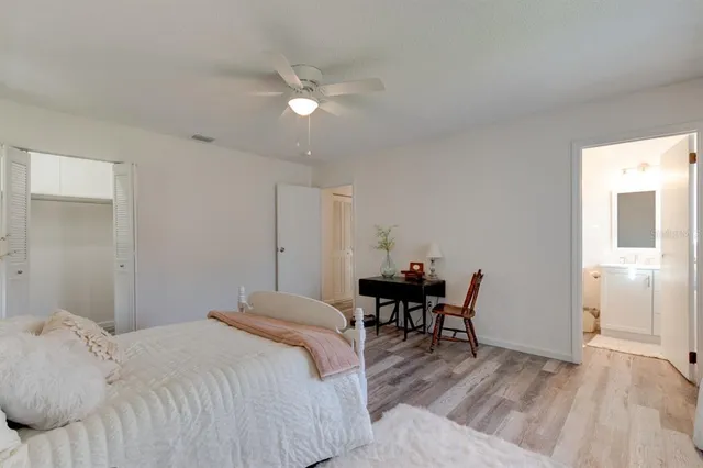 a bedroom with a bed and a table