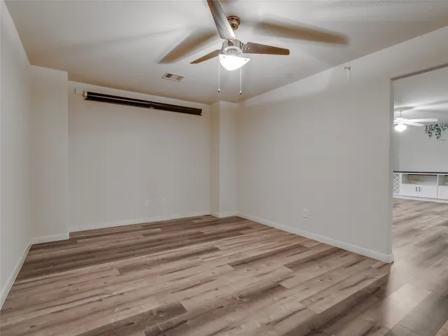 a view of kitchen with furniture and wooden floor