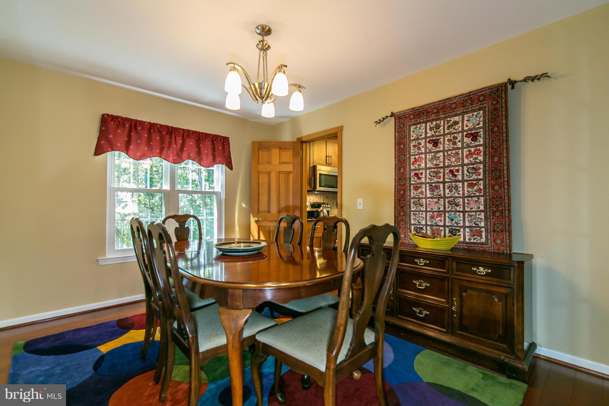 402 Spring Ridge Court Sterling, VA 20164 - Photo 7 of 30 The dining room has Brazilian cherry hardwoods.