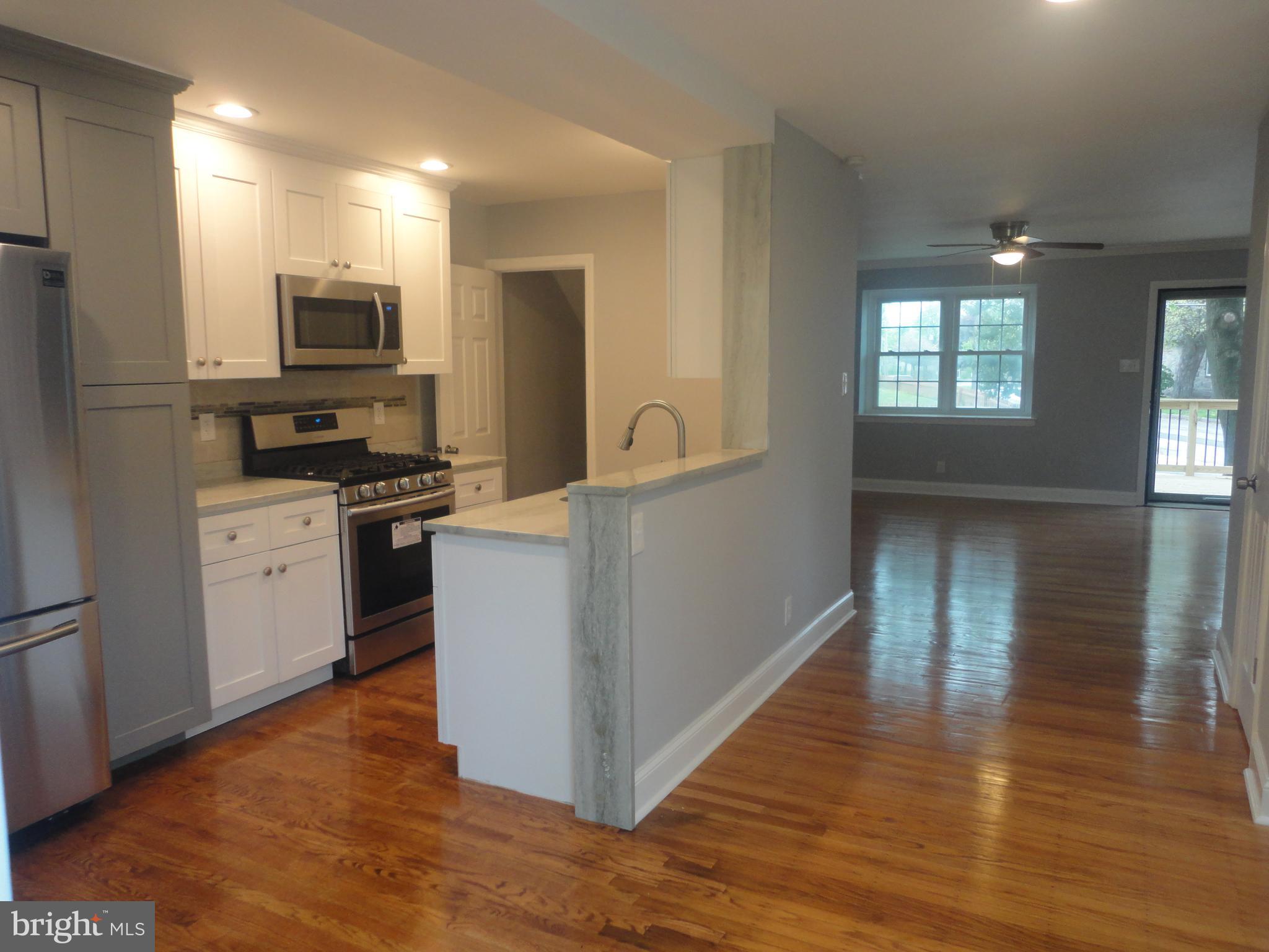 77 Greenhill Road Media, PA 19063 - Photo 7 of 22 View of Kitchen & Dining Room into Living Room