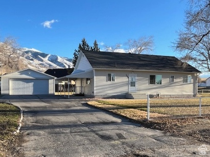 7866 Center Street Lake Point, UT 84074 - Photo 1 of 1 View of side of home with a garage and an outdoor structure