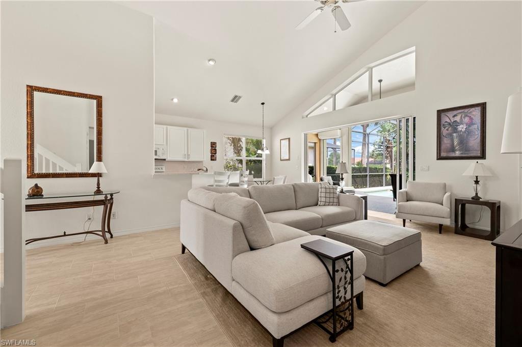 17887 Modena Road Miromar Lakes, FL 33913 - Photo 11 of 50 a living room with furniture and a table