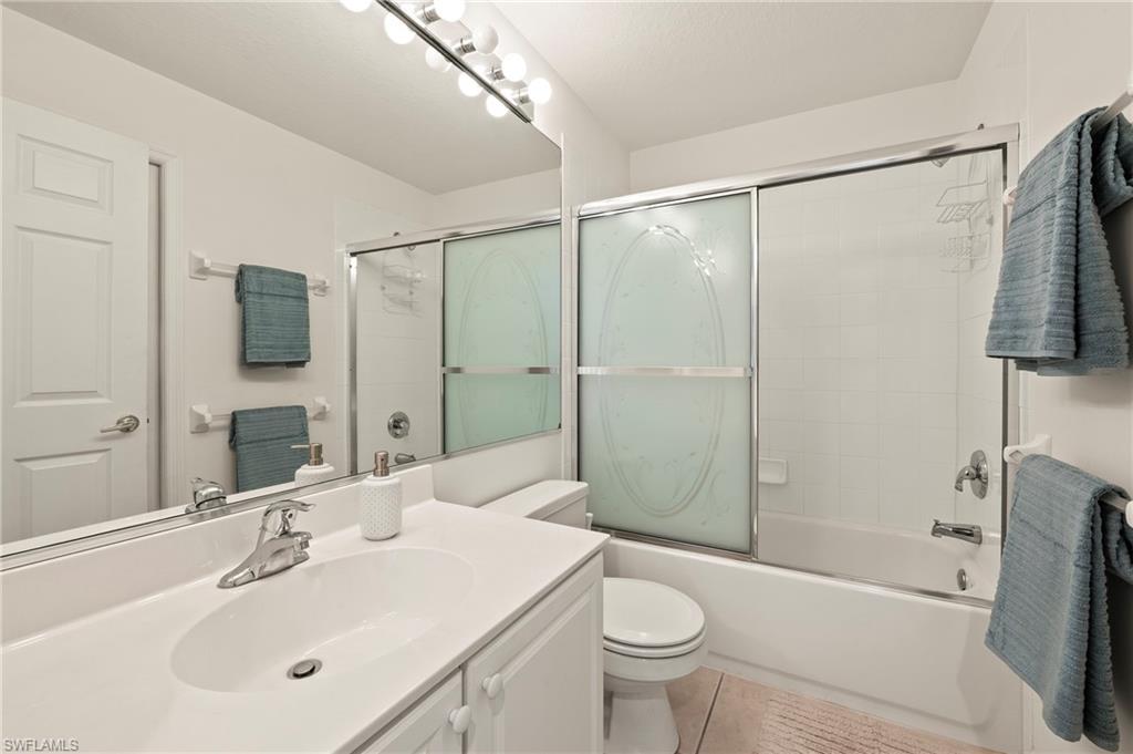 17887 Modena Road Miromar Lakes, FL 33913 - Photo 19 of 50 a bathroom with a sink toilet and shower