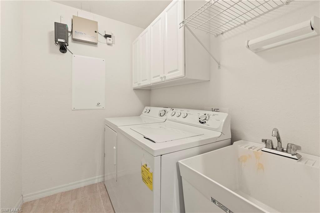 17887 Modena Road Miromar Lakes, FL 33913 - Photo 20 of 50 a utility room with dryer and washer