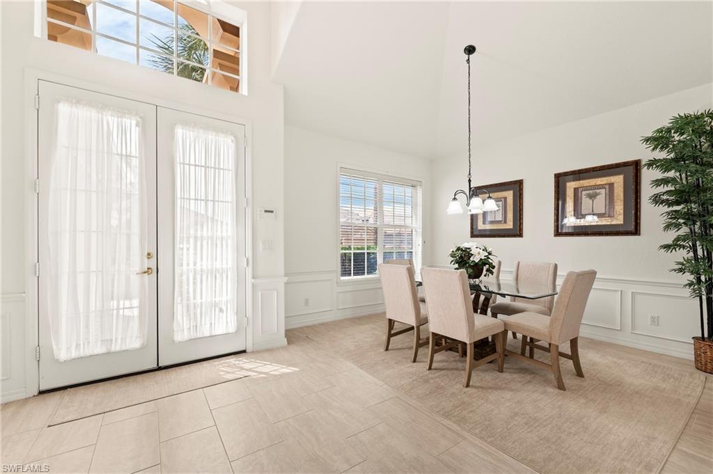 17887 Modena Road Miromar Lakes, FL 33913 - Photo 2 of 50 a dining room with furniture and window