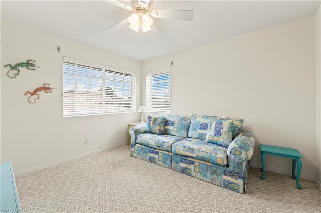 17887 Modena Road Miromar Lakes, FL 33913 - Photo 22 of 50 a living room with furniture and a window