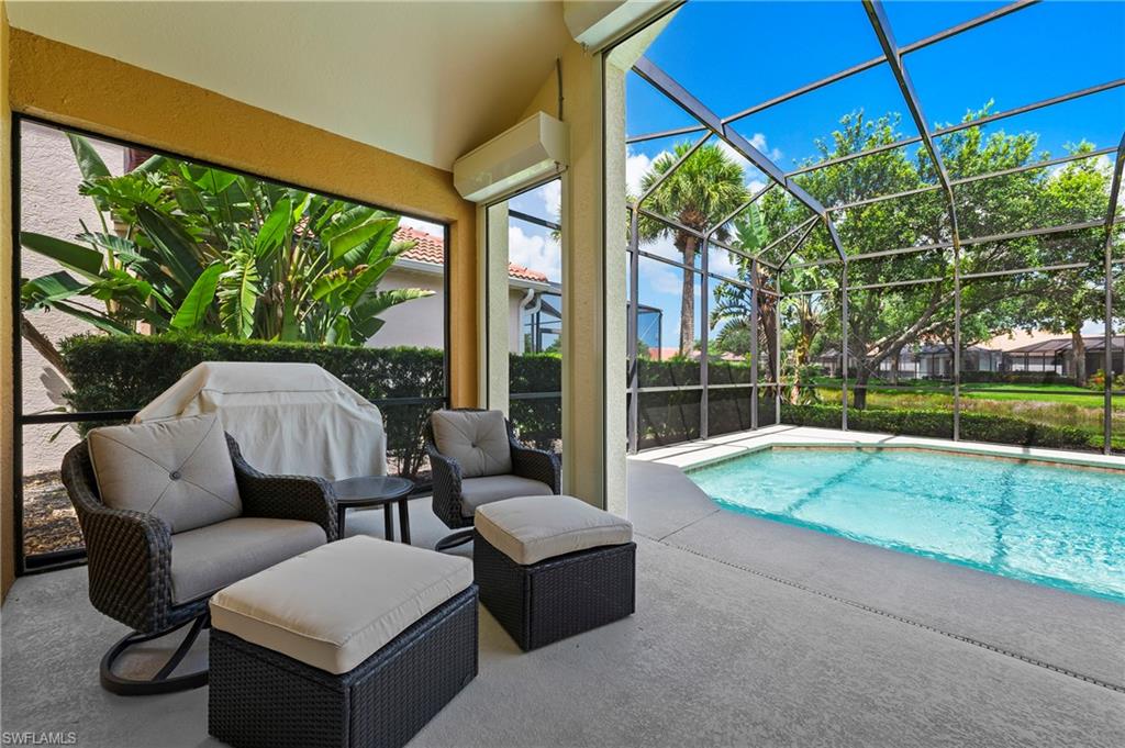 17887 Modena Road Miromar Lakes, FL 33913 - Photo 26 of 50 a outdoor living space with furniture and garden view