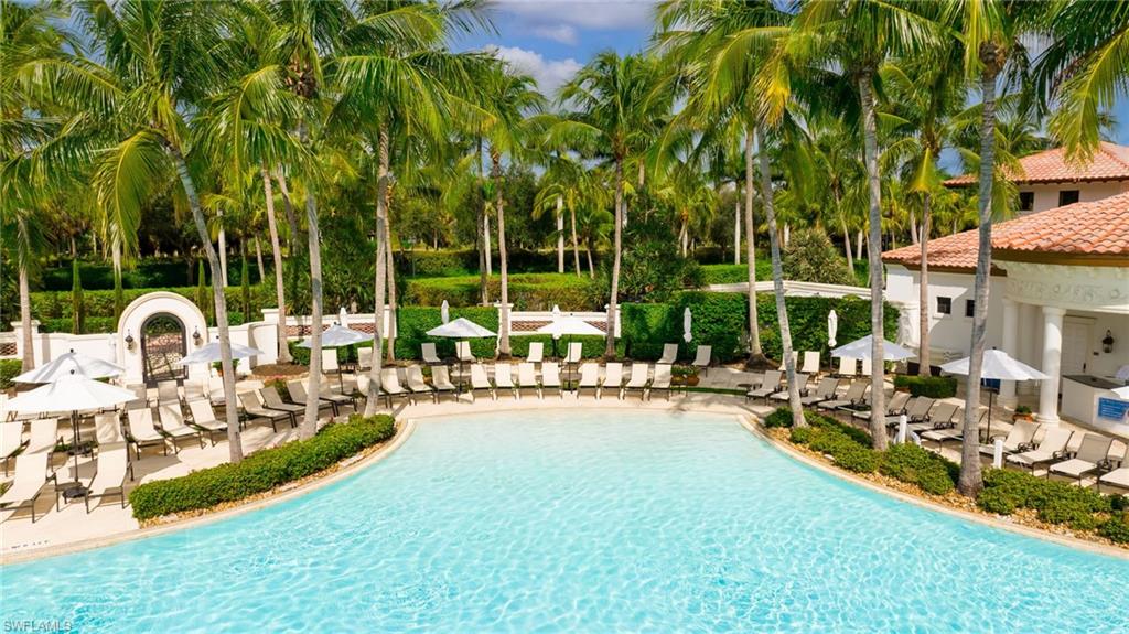 17887 Modena Road Miromar Lakes, FL 33913 - Photo 36 of 50 a view of a yard with a table and chairs
