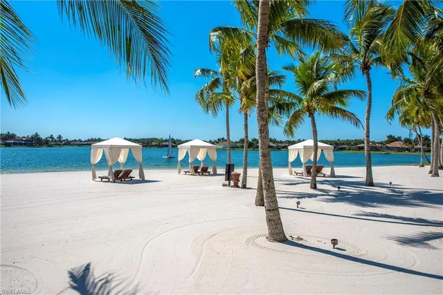 a view of patio with table and chairs and potted plants