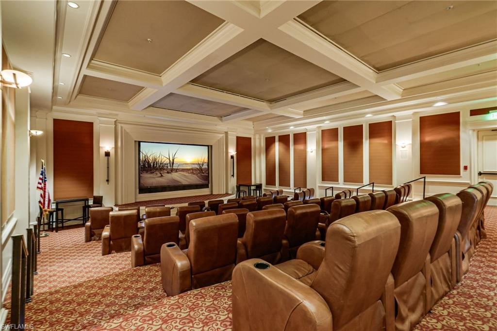 17887 Modena Road Miromar Lakes, FL 33913 - Photo 47 of 50 a media room with lots of chairs and a projector