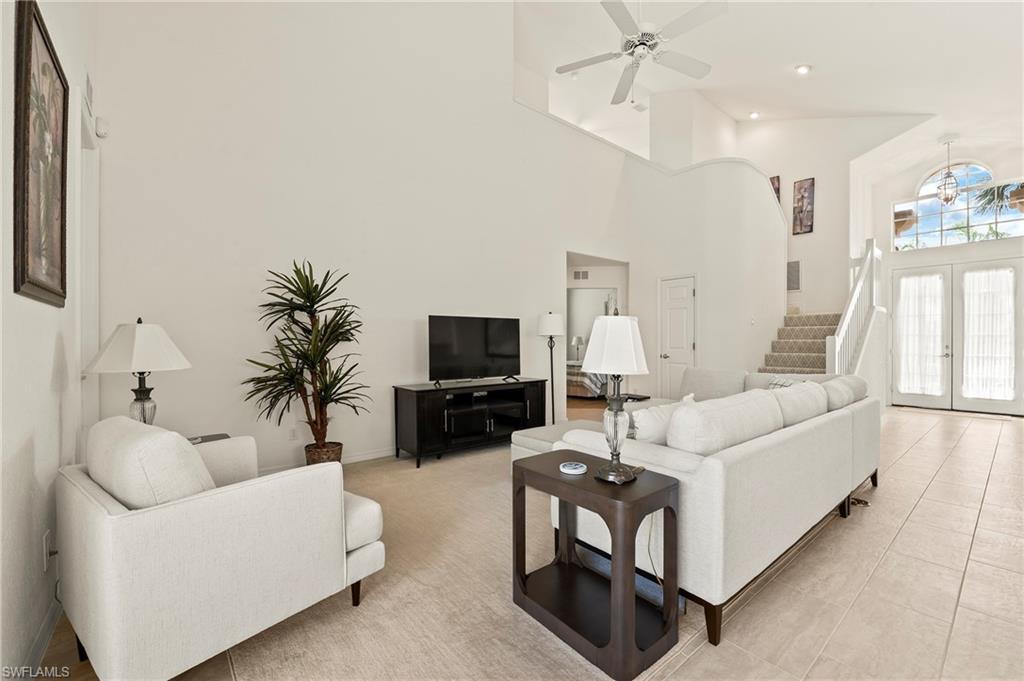 17887 Modena Road Miromar Lakes, FL 33913 - Photo 7 of 50 a living room with furniture and a flat screen tv