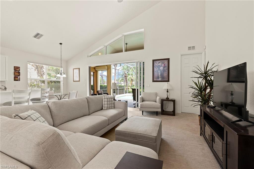 17887 Modena Road Miromar Lakes, FL 33913 - Photo 10 of 50 a living room with furniture and a flat screen tv