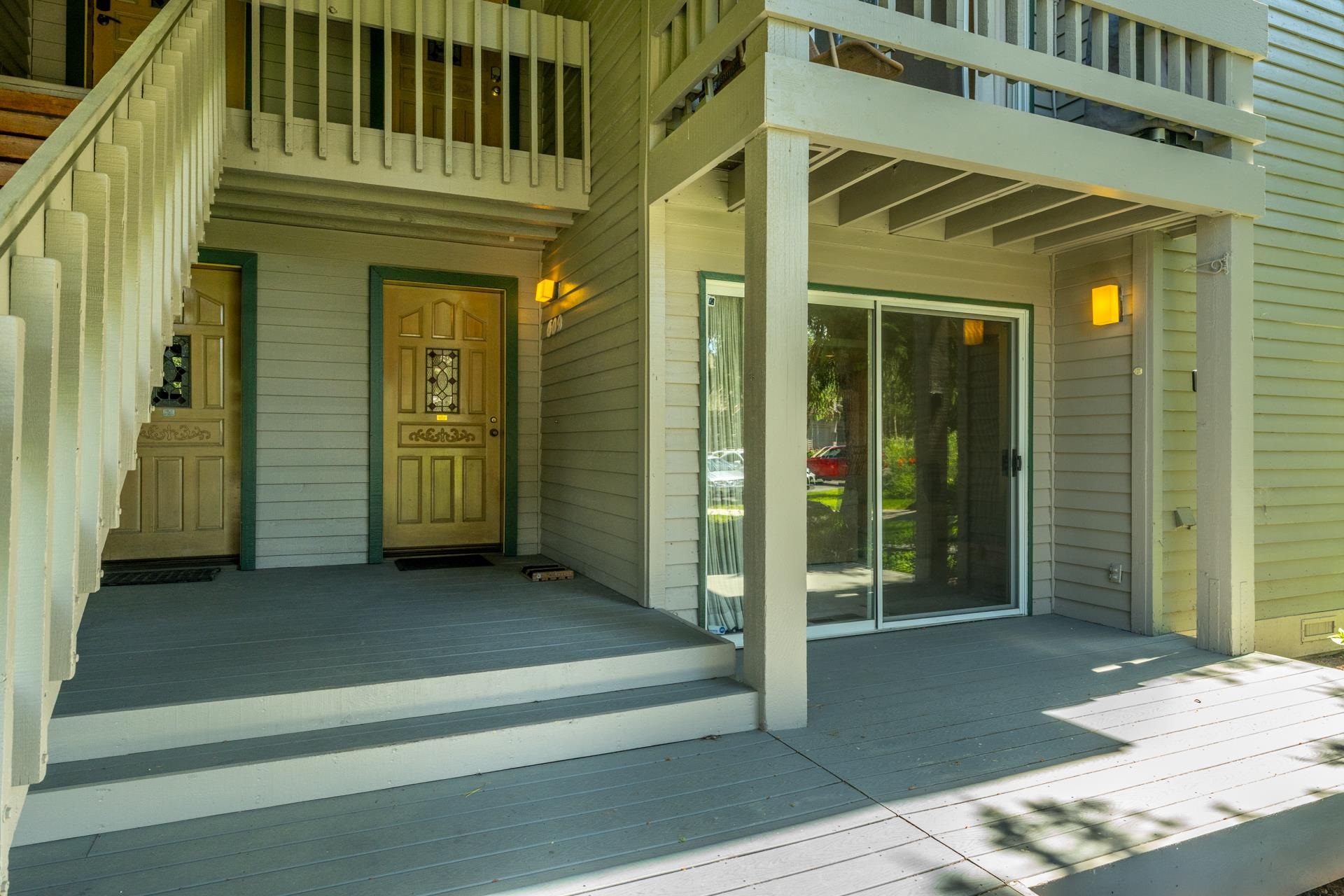 609 Golden Creek Road, Unit 609 Mammoth Lakes, CA 93546 - Photo 32 of 42 Ground-level patio with two entry doors featuring decorative glass inserts and a sliding glass door