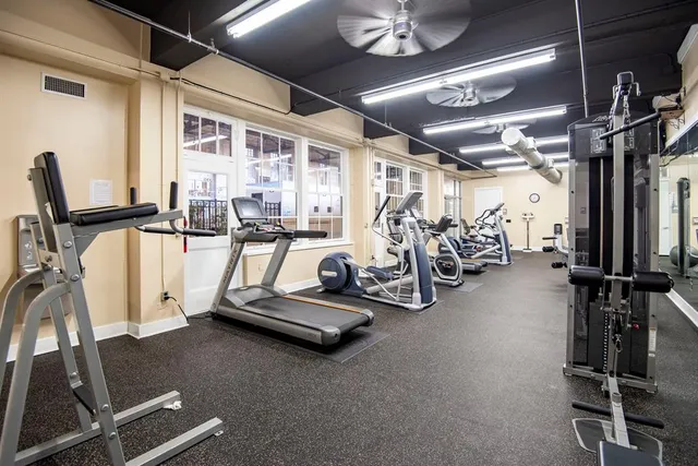 a view of a patio with table and chairs
