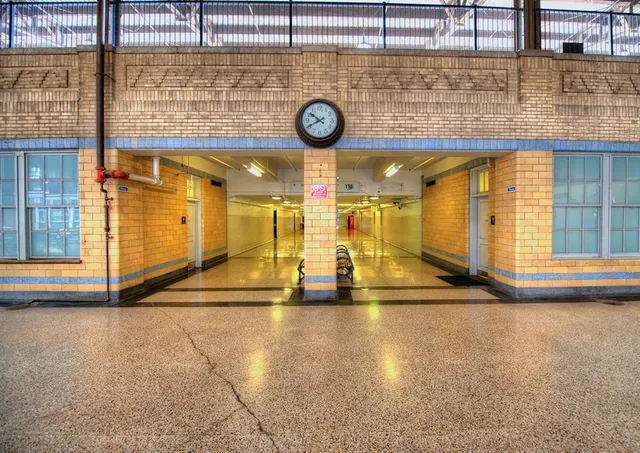 a view of a building with garden and sitting area