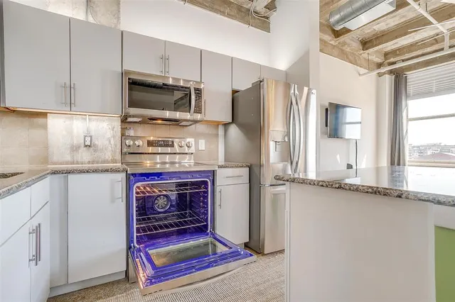 a bedroom with furniture and a flat screen tv