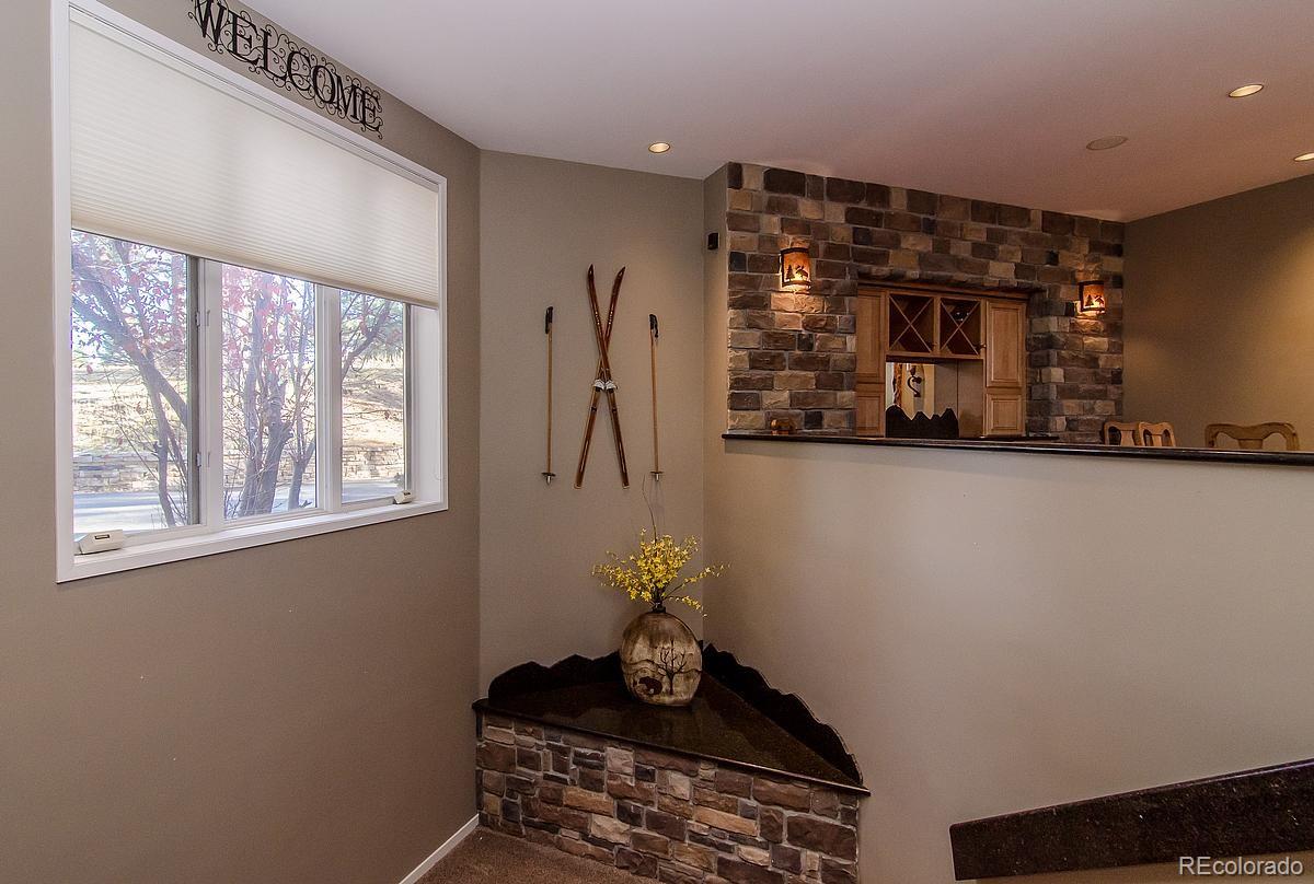 955 Castle Ridge Road Golden, CO 80401 - Photo 17 of 27 a room with furniture and window
