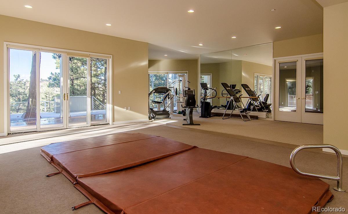 955 Castle Ridge Road Golden, CO 80401 - Photo 19 of 27 a view of a room with gym equipment