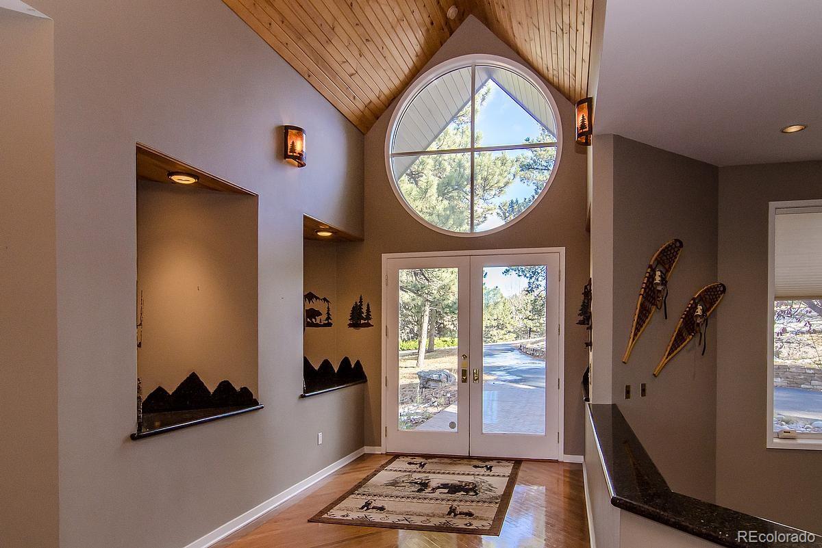 955 Castle Ridge Road Golden, CO 80401 - Photo 2 of 27 a view of entryway with wooden floor