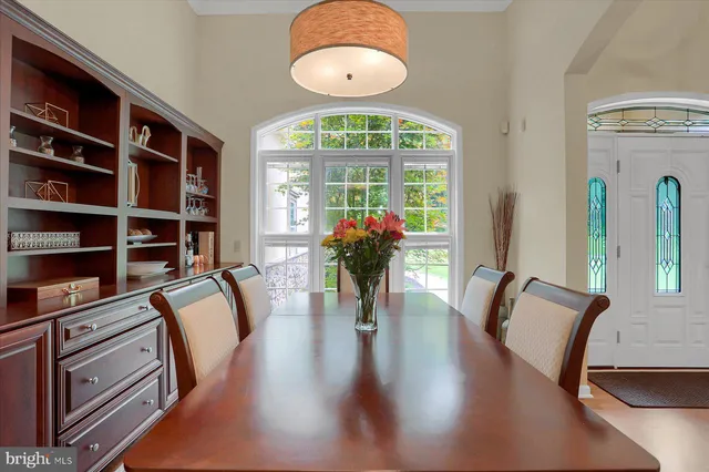 a bathroom with a sink a toilet a glass door shower and mirror