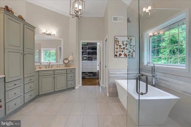 a living room with furniture and a book shelf