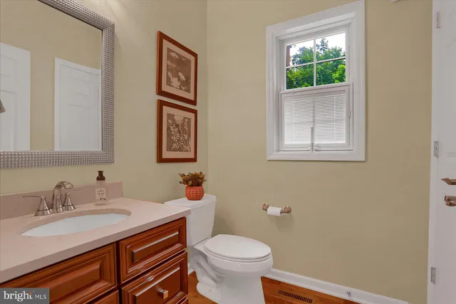 a kitchen with stainless steel appliances granite countertop wooden cabinets a stove top oven a sink and dishwasher