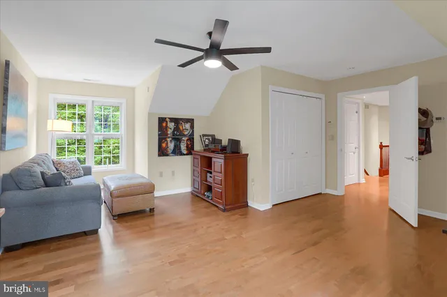 a living room with furniture a rug and a fireplace