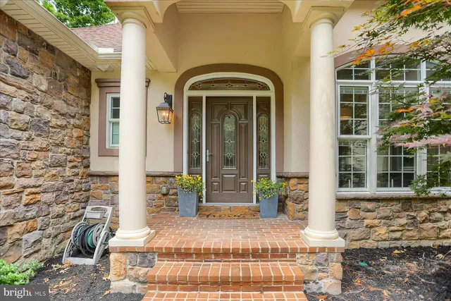 a kitchen with stainless steel appliances white cabinets and a refrigerator