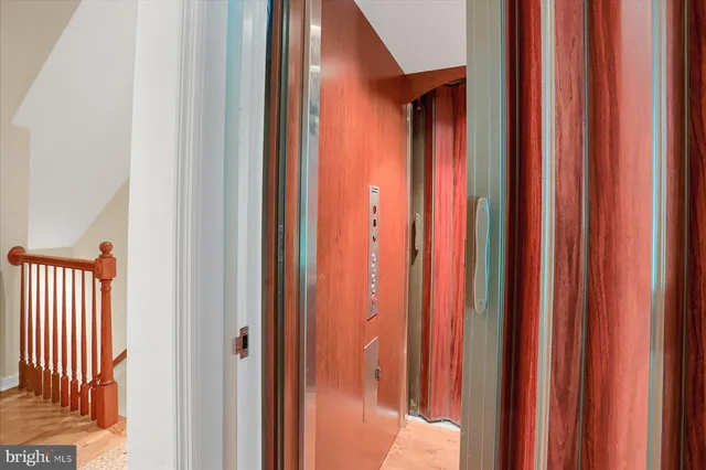 an aerial view of a house with a yard basket ball court and outdoor seating