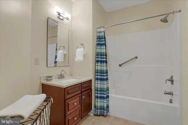 an aerial view of a house with a yard and lake view