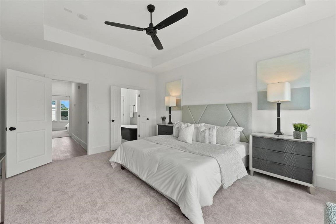 1207 Cavalcade Street, Unit B Houston, TX 77009 - Photo 13 of 20 a bedroom with a bed and a lamp on dresser